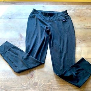 Black Patagonia capilene base layer pants.
